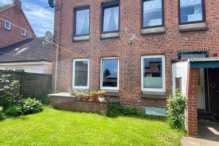 3,5 Zimmer Wohnung im EG mit Grundstück und Carport
